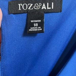 Summer dress with light shell over the shoulders. It is attached to the dress